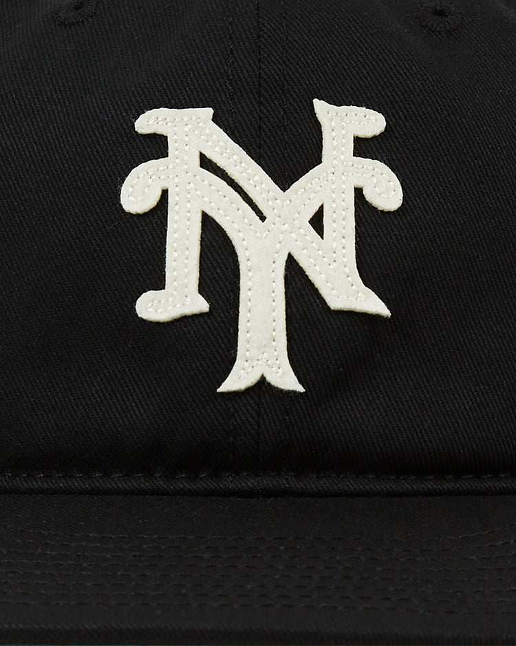 The Ebbets Field New York Cubans Cotton Twill Ballcap is a classic black cap with a white interlocking NY logo, honoring the legacy of the New York Cubans from the Negro League.