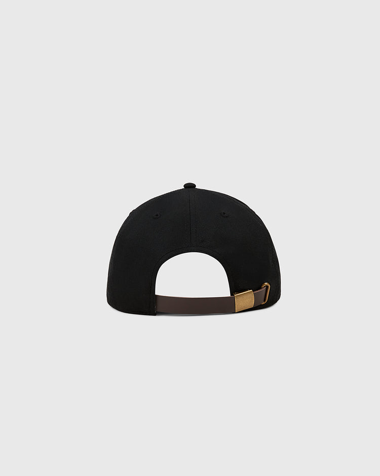 The Ebbets Field New York Cubans Cotton Twill Ballcap is shown from the back, with a brown adjustable strap and brass buckle. Inspired by the Negro League team, it features a black design against a light gray background.