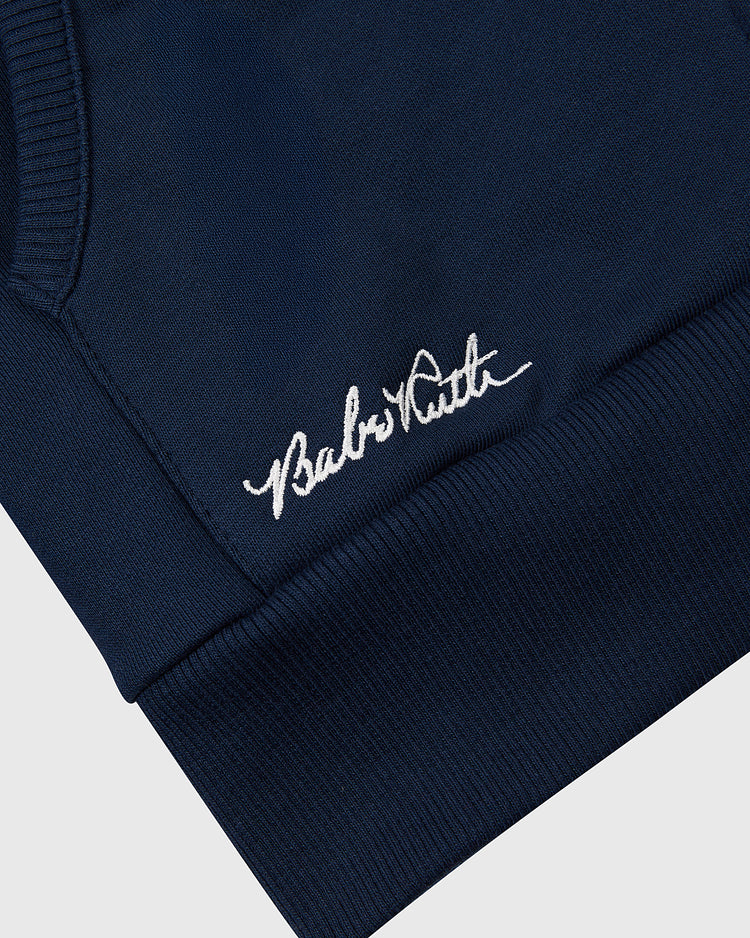 Close-up of the Ebbets Field Babe Ruth Heavyweight Cotton Terry Full-Zip Hoodie’s navy cuff, with white 