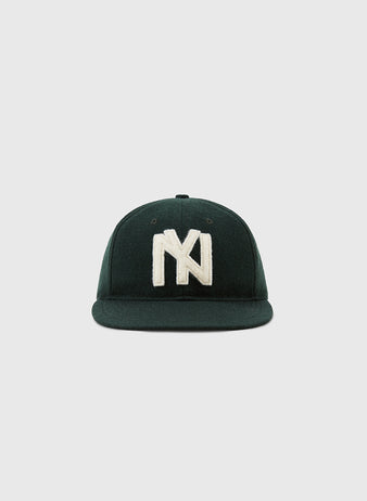 The Brooklyn Eagles 1935 Wool Ballcap by Ebbets Field is a dark green cap with a large white embroidered NY logo, inspired by the historic Negro Leagues, shown against a plain light gray background.