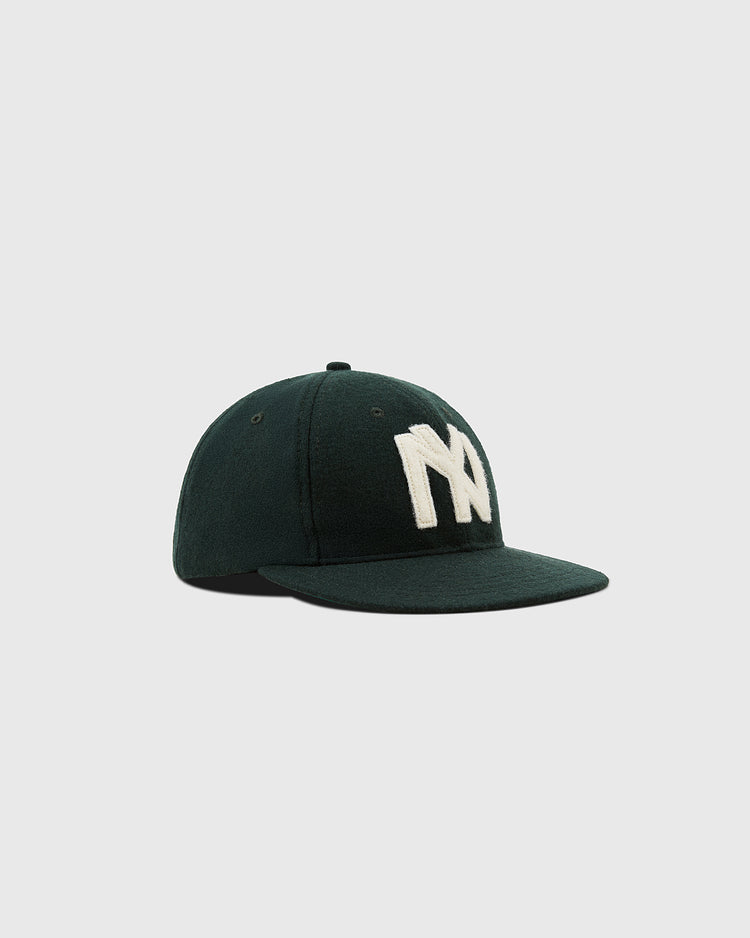 The Brooklyn Eagles 1935 Wool Ballcap by Ebbets Field features a dark green design, flat brim, and bold white NY logo, inspired by Negro Leagues legacy—shown on a simple light gray background.