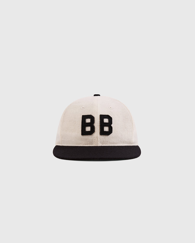 The Ebbets Field Babe Ruth Bustin' Babes Authentic Wool Ballcap features a white crown, black brim, and bold front 