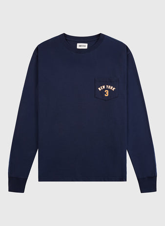 The Ebbets Field New York 1939 World's Fair Long Sleeve Graphic Tee is a navy shirt with a left chest pocket and “NEW YORK 3” in light print—a subtle nod to Babe Ruth.