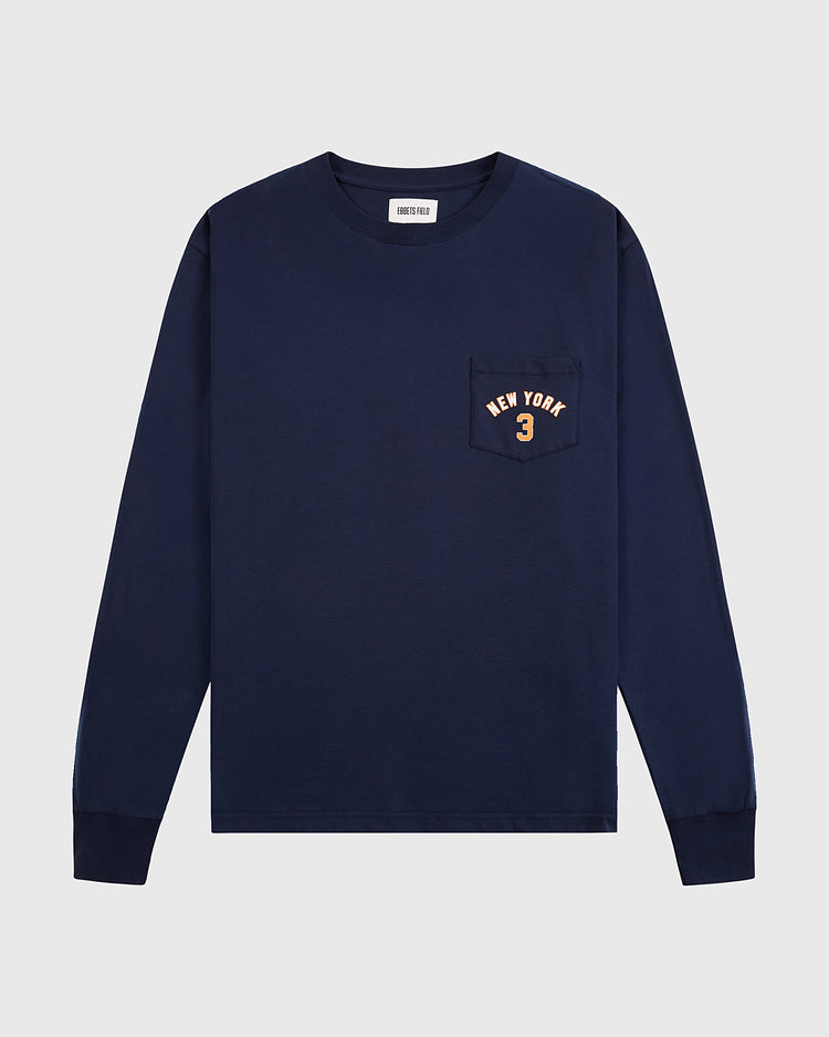 The Ebbets Field New York 1939 World's Fair Long Sleeve Graphic Tee is a navy shirt with a left chest pocket and “NEW YORK 3” in light print—a subtle nod to Babe Ruth.