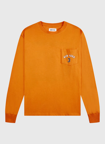 The Ebbets Field New York 1939 World's Fair Long Sleeve Graphic Tee features a chest pocket with NEW YORK 3 embroidered in white and blue, ribbed cuffs, and a crew neck—blending classic Yankees style with World’s Fair inspiration.