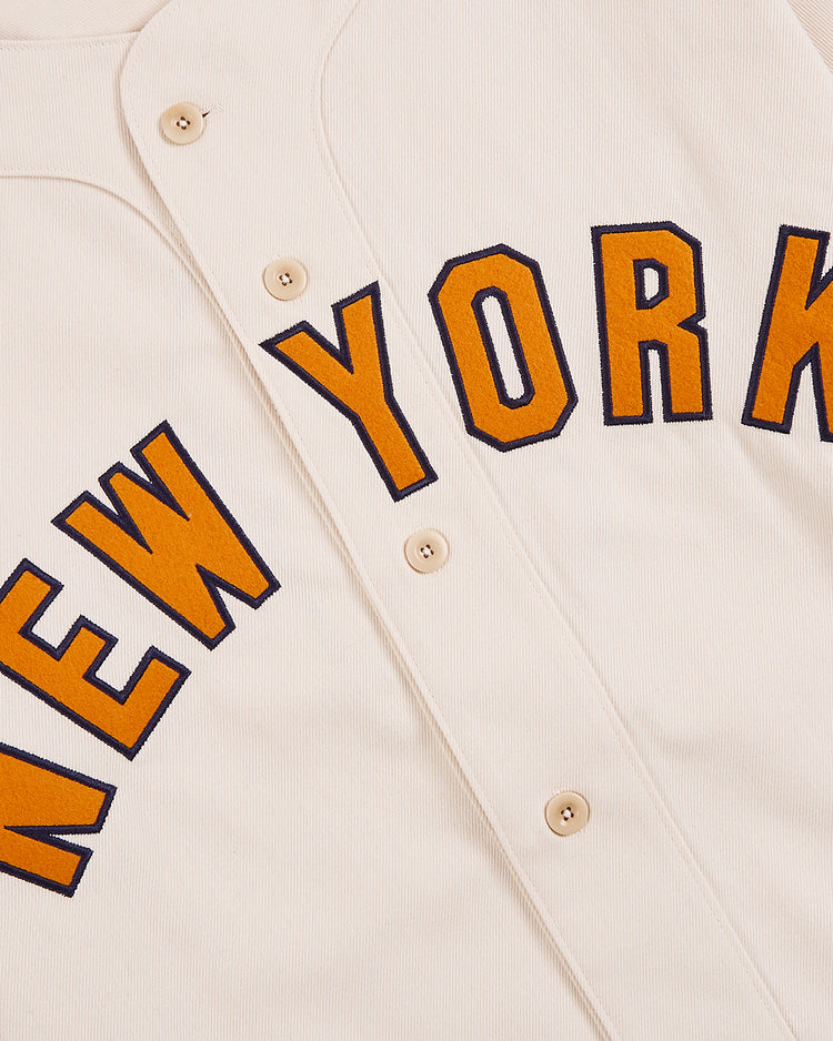 A close-up of the Ebbets Field New York 1939 World's Fair Cotton Baseball Jersey, cream-colored with 