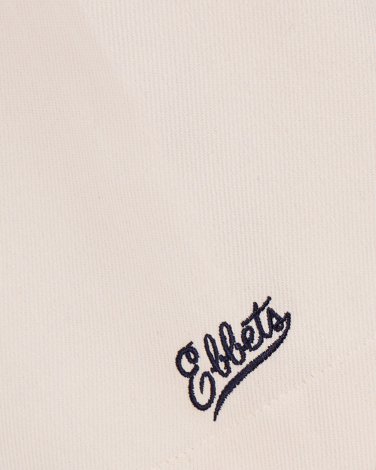 Close-up of natural cotton twill fabric, inspired by the 1939 WORLD'S FAIR JERSEY from Ebbets Field, featuring 