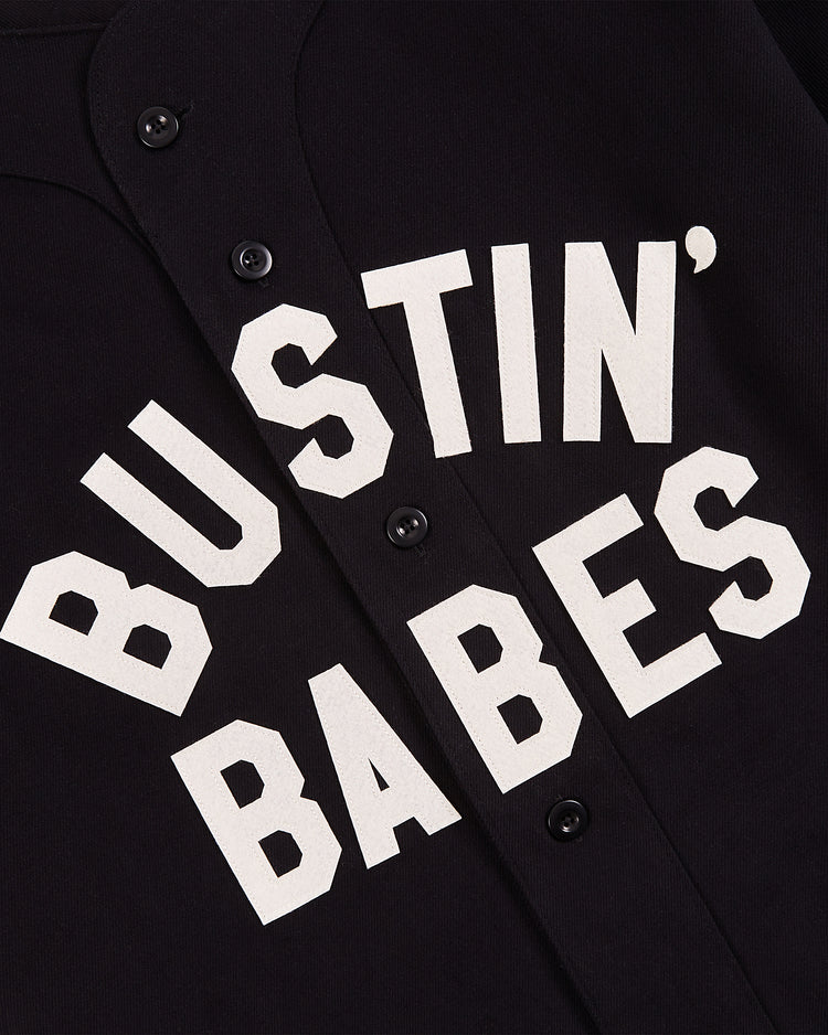 Close-up of the Ebbets Field Babe Ruth Bustin' Babes Cotton Twill Baseball Jersey, featuring bold white 