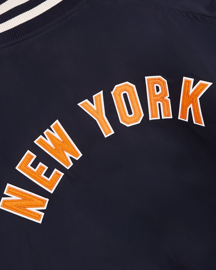 The Ebbets Field New York 1939 World's Fair Satin Varsity Jacket is navy blue, with white and orange 