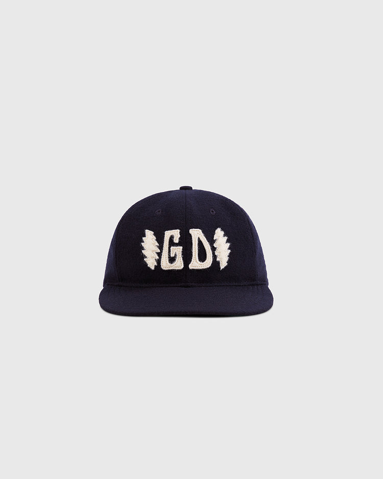 The Ebbets Field Grateful Dead Double Bolt Wool Ballcap features navy blue wool, white GD embroidery, and two lightning bolts, displayed against a plain light gray background.