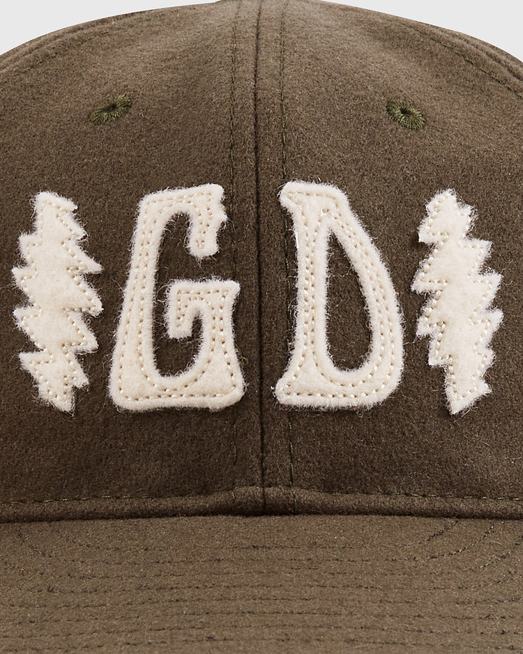 The Grateful Dead Double Bolt Wool Ballcap by Ebbets Field is crafted from olive-green wool broadcloth and features textured white 
