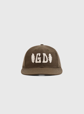 The Ebbets Field Grateful Dead Double Bolt Wool Ballcap is a brown hat with a flat brim, bold white GD embroidery, and two white zigzag bolts on the sides, shown against a plain white background.