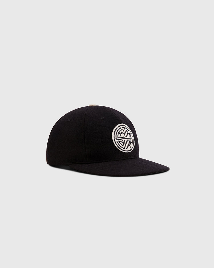 The Ebbets Field Mystery Caps of Mexico – Centro Union Authentic Wool Ballcap is a black flat-brim cap with a white circular embroidered logo, honoring Mexican baseball history. Shown on a plain light gray background.