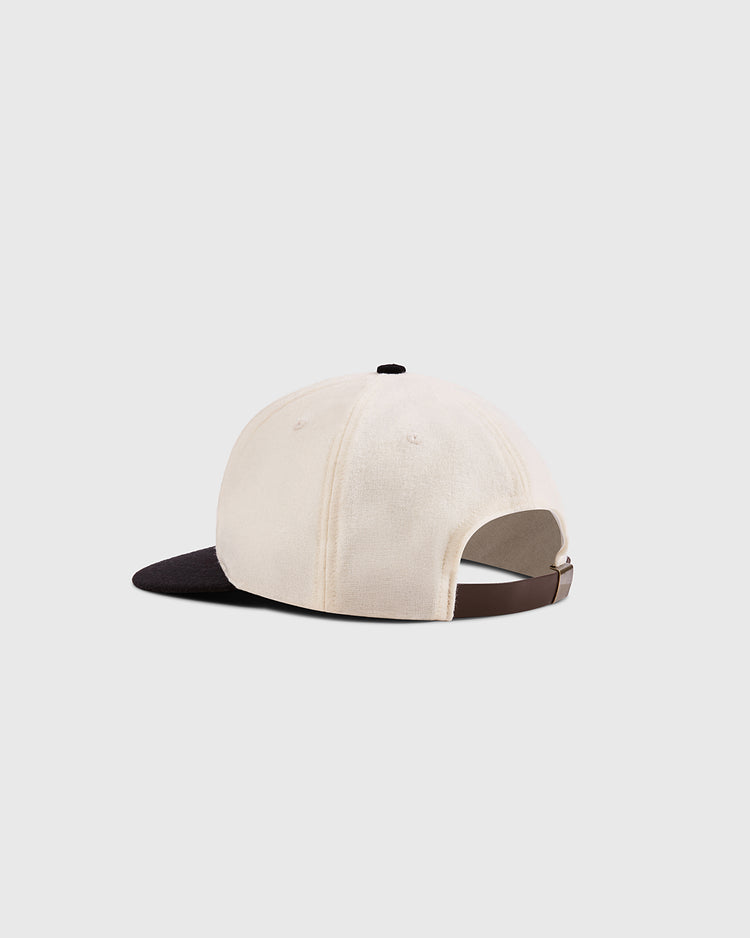 The Ebbets Field Mystery Caps of Mexico – Aviacion 1917 Authentic Wool Ballcap features a cream crown, dark brim, and adjustable brown strap, celebrating Mexican baseball history on a plain light background.