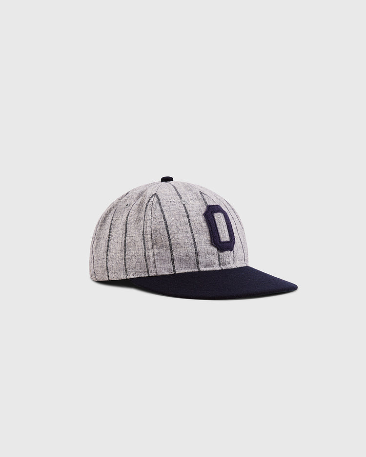 The Ebbets Field Osaka Tigers 1945 Authentic Wool Ballcap features grey wool with black pinstripes, a navy brim, and a navy 