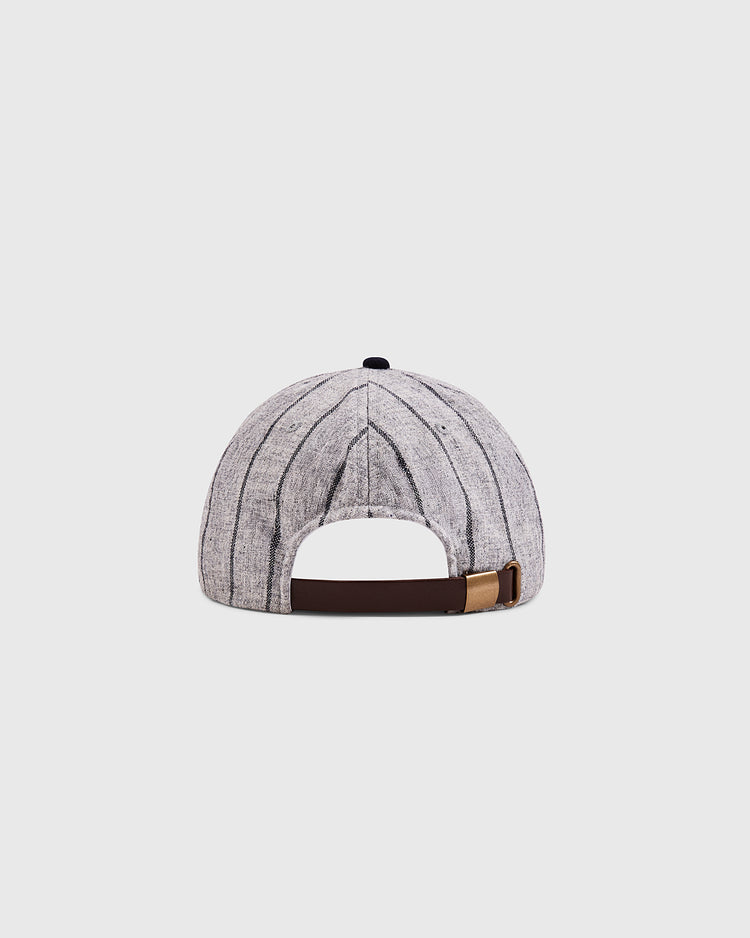 The Ebbets Field Osaka Tigers 1945 Authentic Wool Ballcap is shown from the back, displaying gray and white stripes, a brown adjustable strap with a gold buckle, and set against a plain light background.