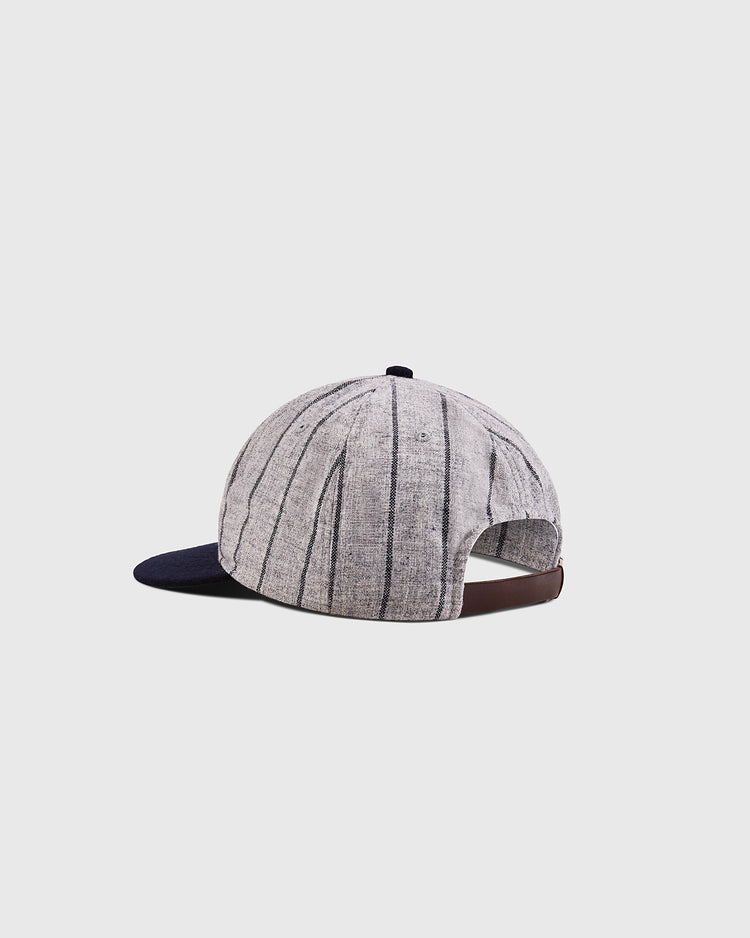 The Ebbets Field Osaka Tigers 1945 Authentic Wool Ballcap features gray wool with dark pinstripes, a navy brim, and a brown adjustable strap, shown on a plain light background.