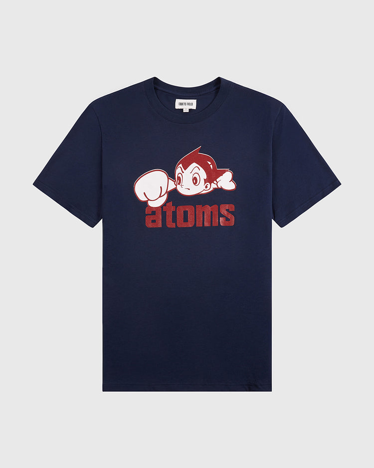 The Ebbets Field Sankei Atoms Short Sleeve Graphic Tee features a cartoon character with large eyes and a raised fist above bold red 