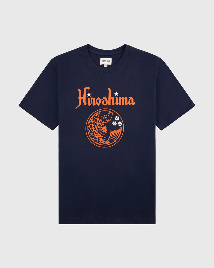 The Hiroshima Carp Short Sleeve Graphic Tee by Ebbets Field features an orange koi jumping over waves with a star above the text on navy blue, shown on a plain light gray background—a perfect nod to vintage baseball style.