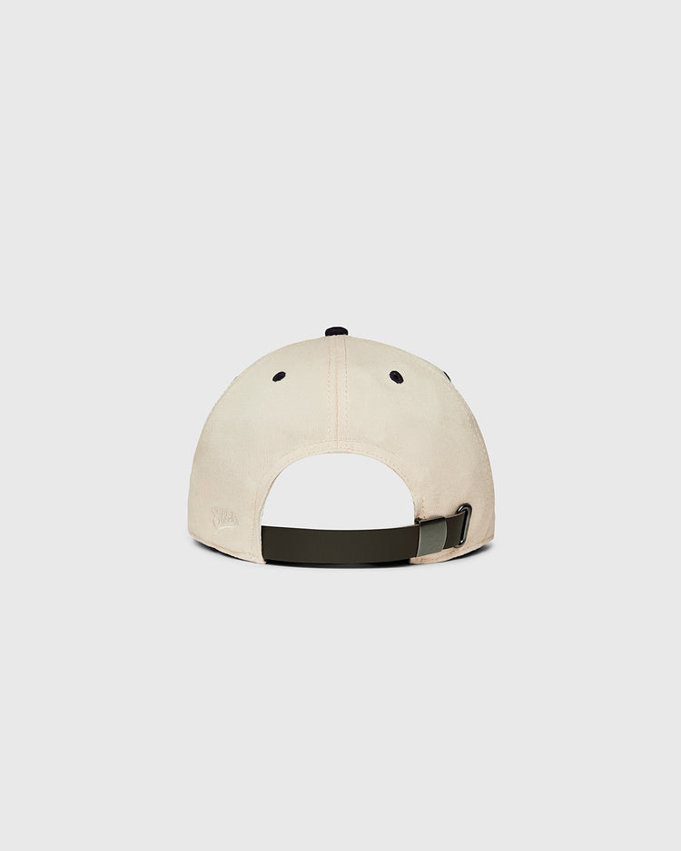 A beige Ebbets Field New York 1939 World's Fair cotton twill ballcap is shown from the back, with an adjustable dark green strap, metal buckle, and a curved opening. The background is plain light gray.