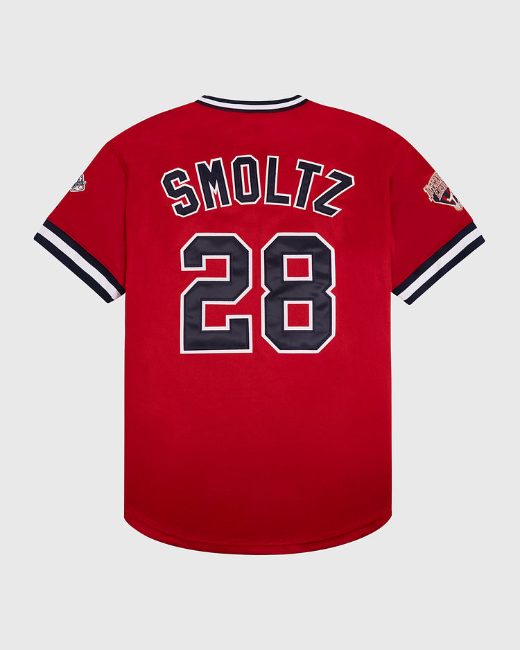 The Ebbets Field John Smoltz Richmond Braves V-Neck Jersey is red with black and white trim, SMOLTZ and number 28 in white outline on the back, classic minor league style, and features sleeve patches.