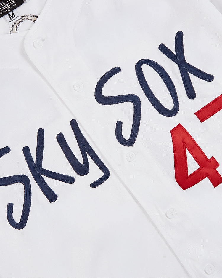 Close-up of the Ebbets Field Jim Thome Colorado Springs Sky Fox Button Up Jersey, featuring stitched SOX in large blue letters, red number 47, and classic white buttons.