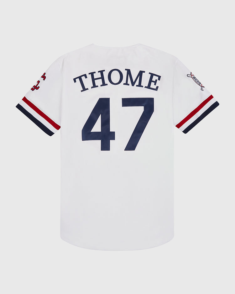The Ebbets Field Jim Thome Colorado Springs Sky Fox Button Up Jersey features a white design with navy blue 47 on the back, plus red, white, and navy sleeve stripes with small team logos—classic minor league style.