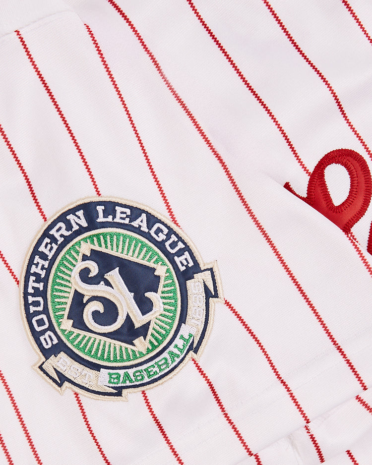 The EFF Chattanooga Lookouts MiLB Button Down Jersey is a white jersey with red pinstripes, an embroidered Southern League patch, and part of a red script letter, evoking classic Chattanooga Lookouts style.