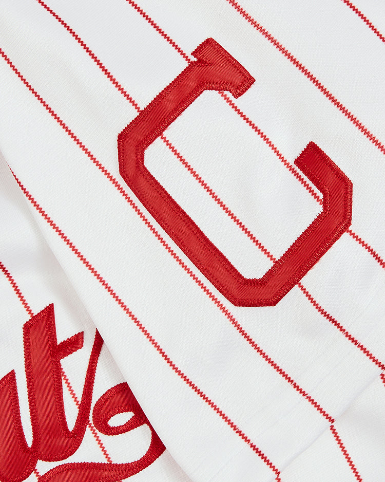 Close-up of the EFF Trevor Hoffman Chattanooga Lookouts Button Up Jersey: white with thin red stripes, a large red embroidered “C,” and overlapping script, echoing classic Chattanooga Lookouts style.