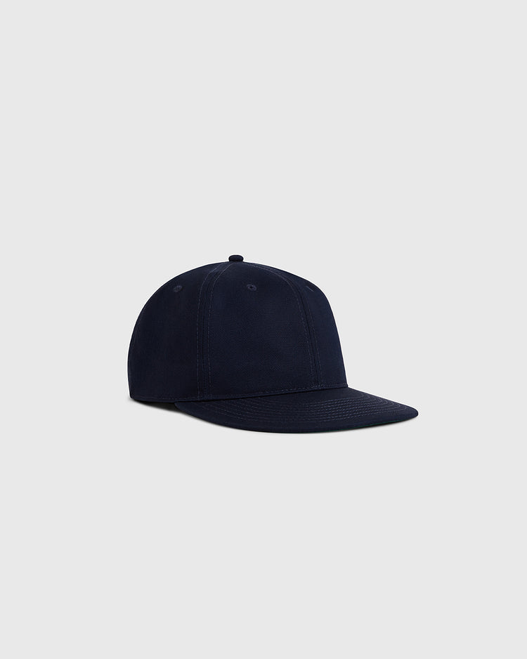 The Ebbets Field Navy Cotton Twill Ballcap features a classic curved brim and vintage design, shown against a light gray background.