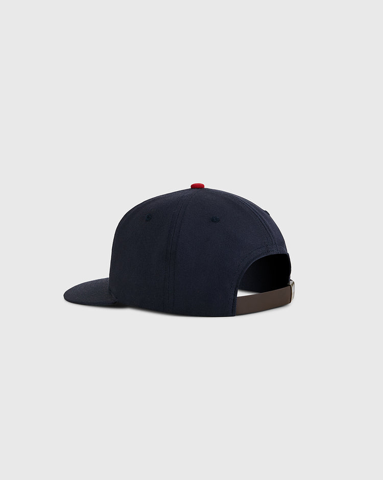 The USA National Team Cotton Twill Ballcap by Ebbets Field is shown from the back, featuring a navy blue design, adjustable brown strap, red top button, and replica baseball hat style against a plain light gray background.