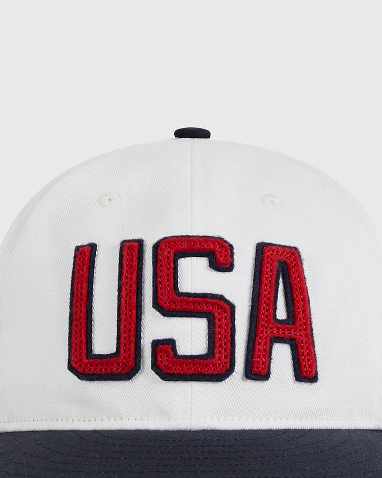 A close-up of the Ebbets Field USA National Team Cotton Twill Ballcap, featuring bold red 