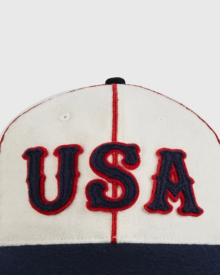 Close-up of the Ebbets Field USA National Team 1936 Authentic Wool Ballcap, featuring large navy blue 