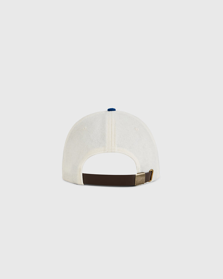 The Ebbets Field USA Miracle On Ice 1960 Wool Ballcap is seen from the back with a dark brown adjustable strap and brass buckle, evoking a vintage hockey style, set against a light gray background.