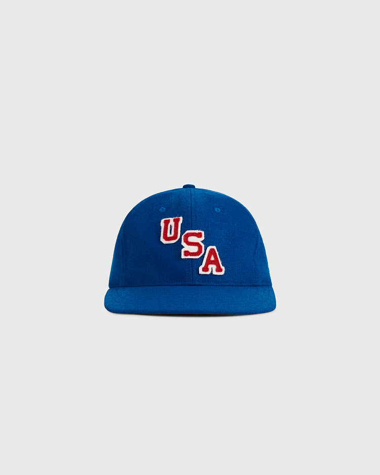 The Ebbets Field USA Miracle On Ice 1960 Wool Ballcap, a blue vintage hockey-style hat with bold red and white 