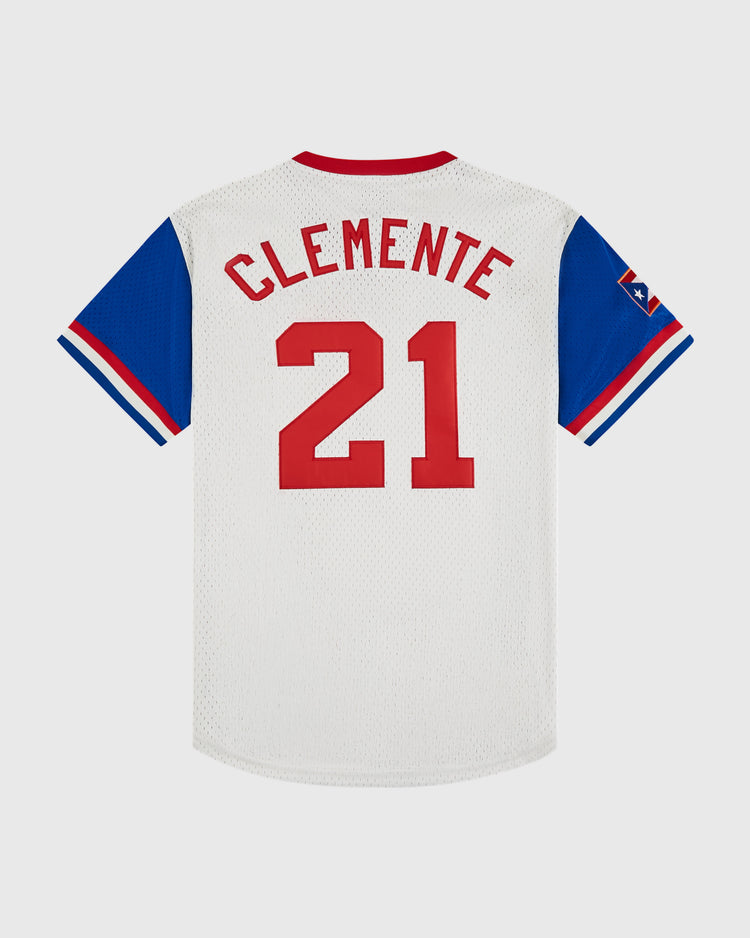 The Ebbets Field Puerto Rico 1976 National Team Mesh V-Neck Jersey is a vintage white baseball top with blue sleeves, red collar and trim, “CLEMENTE” and 21 in red on the back, plus a star patch on the left sleeve.
