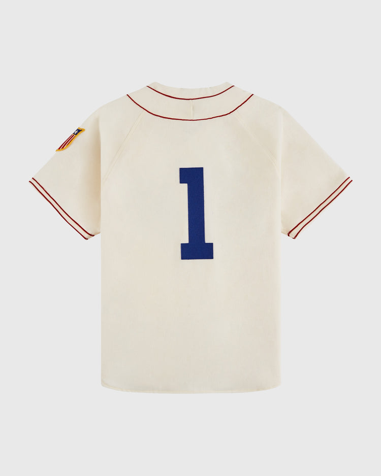 The Ebbets Field USA National Team 1936 Authentic Wool Baseball Jersey features a cream color, red trim, blue #1 on the back, and a red, white, and blue striped sleeve patch—classic style inspired by the 1936 original.