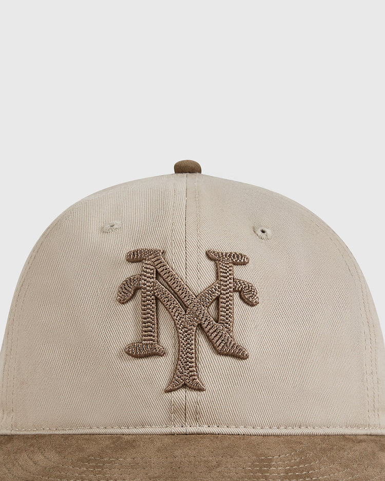 The Ebbets Field New York Cubans 1948 Cotton Twill Suede Ballcap features a beige design with a brown embroidered interlocking NY logo, inspired by the legendary Negro League team.