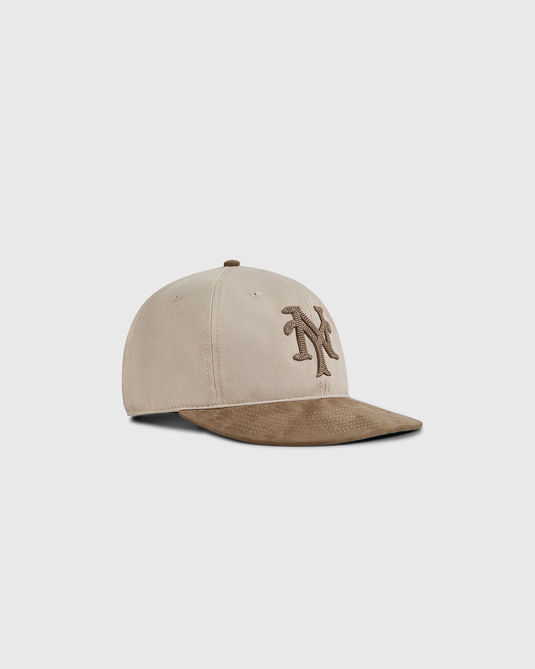 The Ebbets Field New York Cubans 1948 Cotton Twill Suede Ballcap features a beige crown, brown brim, and brown NY logo, inspired by the iconic Negro League team, shown on a plain light background.