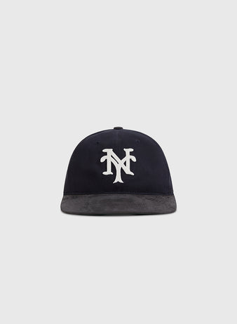 The Ebbets Field New York Cubans 1948 Cotton Twill Suede Ballcap features a navy crown, gray brim, and white interlocking NY logo, inspired by the Negro League team. Shown on a plain light gray background.