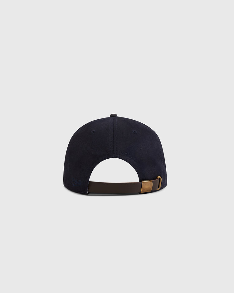The Ebbets Field New York Cubans 1948 Cotton Twill Suede Ballcap in navy, shown from the back, features a brown adjustable strap with a gold buckle—classic vintage style inspired by Negro League baseball.