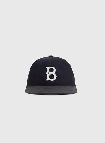The Ebbets Field Brooklyn Royal Giants 1925 Cotton Twill Suede Ballcap is navy blue with a white embroidered 