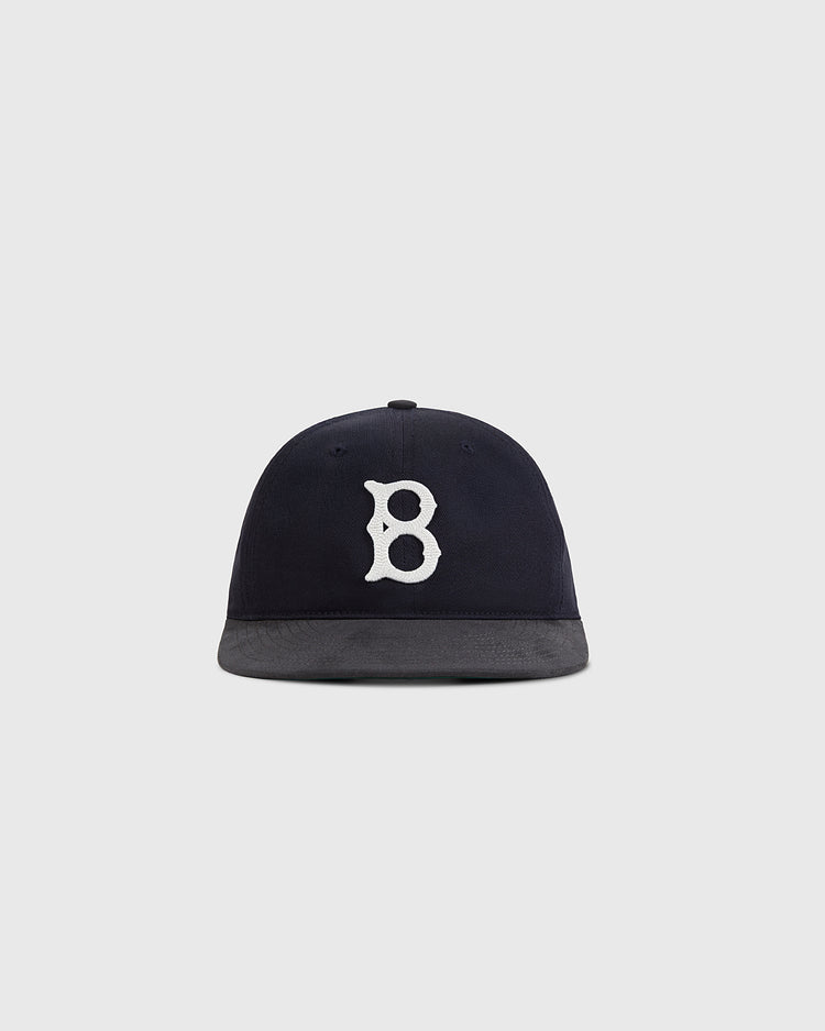 The Ebbets Field Brooklyn Royal Giants 1925 Cotton Twill Suede Ballcap is navy blue with a white embroidered 