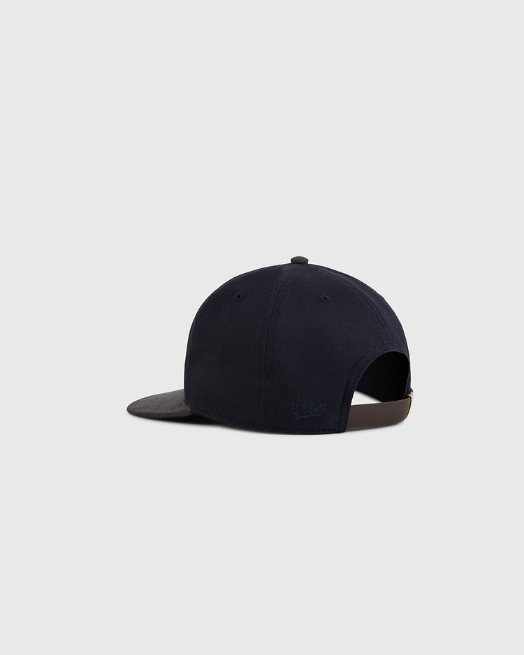 The Ebbets Field Kansas City Monarchs 1945 Cotton Twill Suede Ballcap is shown from the back in navy with a dark gray brim, adjustable strap, and metal clasp, set against a plain light gray background.