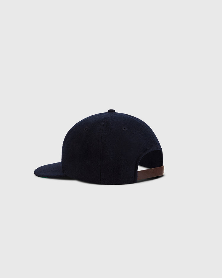 The Ebbets Field Kansas City Monarchs 1945 Authentic Wool Ballcap is shown from the back with an adjustable brown strap and top button, set against a plain light gray background.