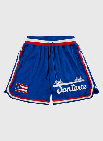 The Ebbets Field Santurce Cangrejeros Mesh Shorts feature blue mesh, red and white stripes, a drawstring waist, the Puerto Rican flag on one leg, and “Santurce” with winged horse logos on the other—a true tribute to Santurce baseball.