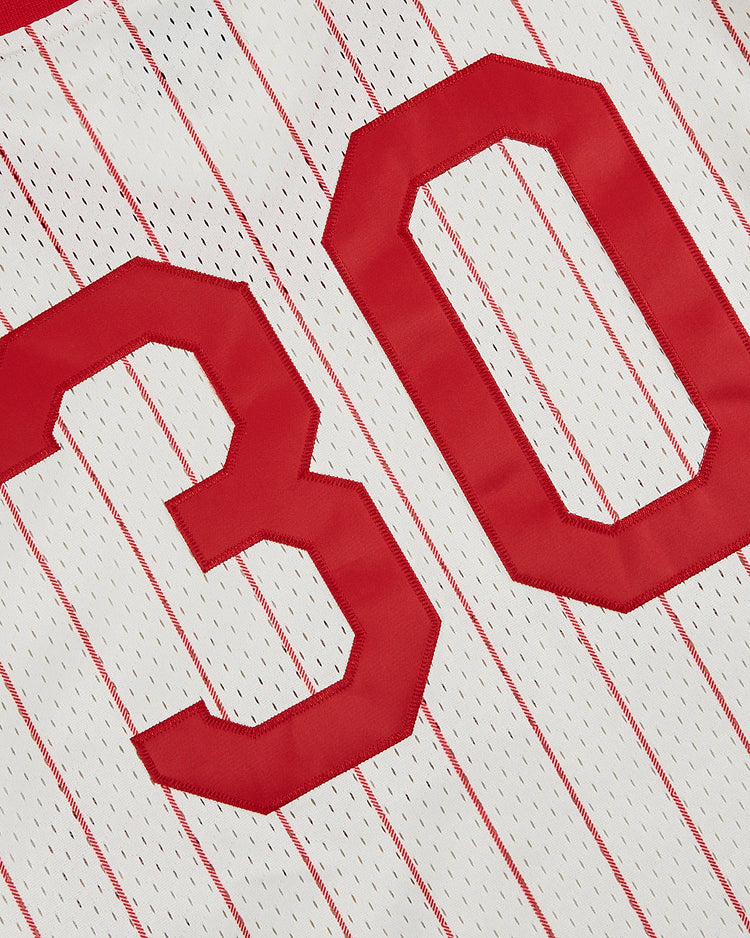 Close-up of the Ebbets Field Havana Cubans Mesh V-Neck Jersey, featuring red vertical pinstripes and bold red numbers 3 and 0, inspired by the classic minor league baseball team.