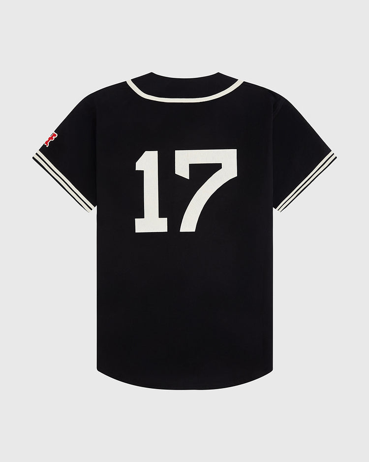 The Ebbets Field New York Cubans Cotton Twill Baseball Jersey is black with white trim on the collar and sleeves, a large white 17 on the back, and a red patch on the left sleeve honoring legendary Negro League and Cuban teams.