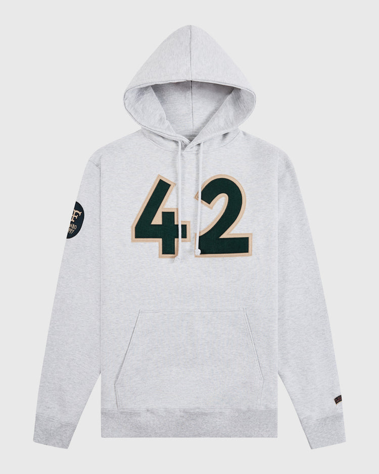 The Ebbets Field Karabo Poppy x Jackie Robinson Heavyweight Cotton Pullover Hoodie features a light gray design, bold green “42” with gold outline, black/gold sleeve patch, front pocket, and drawstrings—an ideal choice for Black History Month.