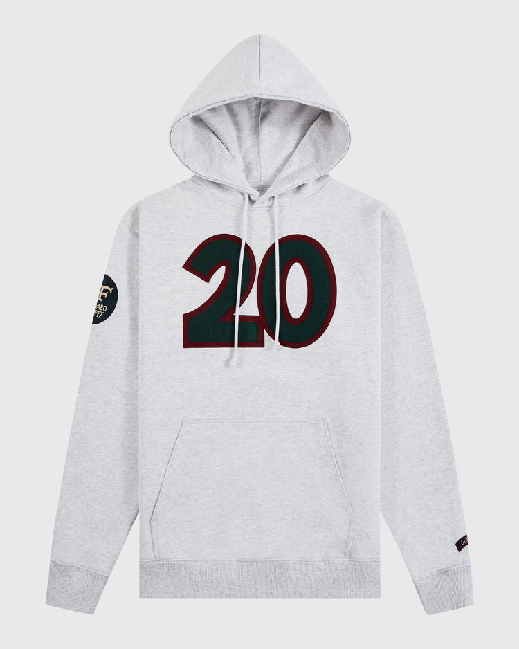The Ebbets Field Karabo Poppy x Josh Gibson Heavyweight Cotton Pullover Hoodie in light gray features a front pocket, bold black and red number 20 on the chest, and a small black circular patch on the left sleeve.